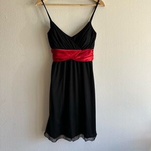 Elegant Black Dress with Red Sash
